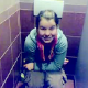 An Eastern-European girl is video recorded pooping while sitting on a toilet in a public restroom. Although the language may sound foreign to you, the plopping sounds will sound quite clear & familiar!